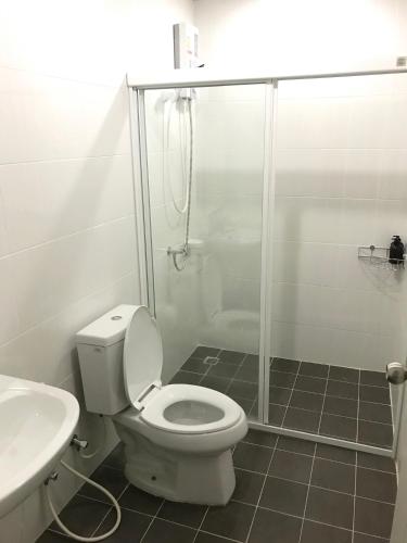 a bathroom with a shower and a toilet and a sink at Impact MT House in Ban Bang Phang