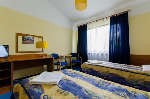 Ένα ή περισσότερα κρεβάτια σε δωμάτιο στο HOTEL A4 Airport Kraków MOP Morawica