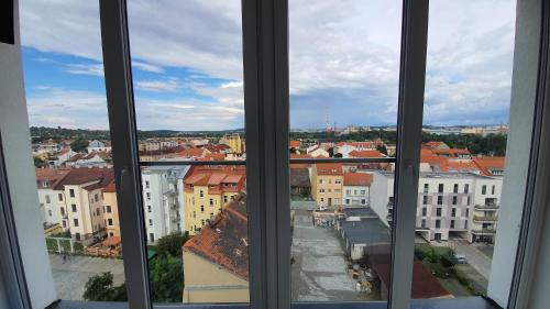 a view of a city from a window at Magic Apartment centre Pilsen in Plzeň