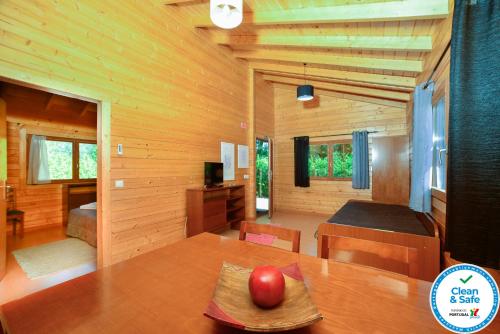 a room with a table with a red apple on it at Quintinha do Casal Ruivo in Figueiró dos Vinhos