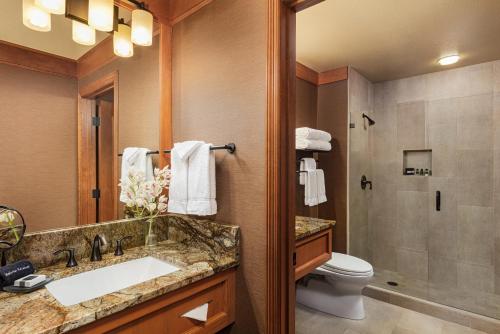 a bathroom with a sink, toilet and shower at Wyoming Inn of Jackson Hole in Jackson