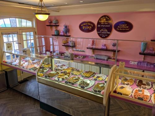 a display case filled with lots of different types of donuts at Murray Hotel in Mackinac Island