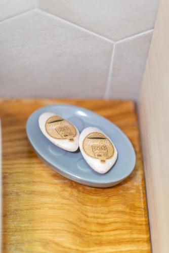 two cookies on a blue plate on a table at Poarta Schei 18 in Braşov