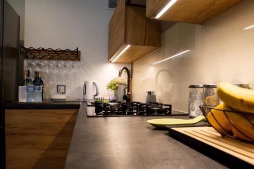 a kitchen with a counter with bananas on it at Apartament Sobieski in Sanok