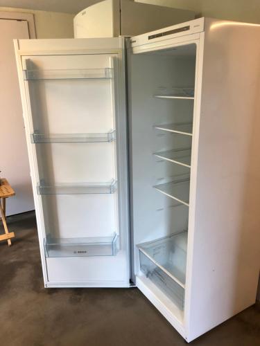 a white refrigerator with its door open at Guesthouse Dybbøl, Sønderborg in Sønderborg