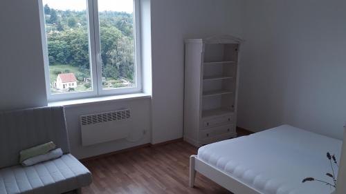Postel nebo postele na pokoji v ubytování Apartmán Vyhlídka