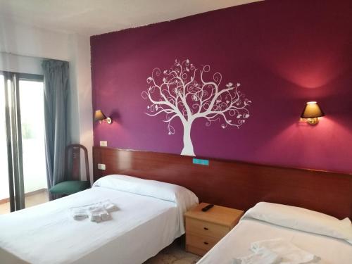 Postel nebo postele na pokoji v ubytování Hostal Jaime I