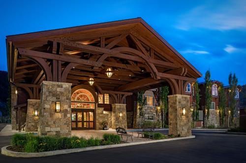 a large building with a wooden roof at Wyoming Inn of Jackson Hole in Jackson