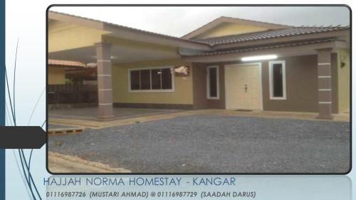a picture of a small house with a driveway at Hajjah Norma Homestay in Kangar