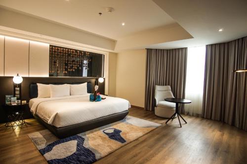 Mercure Jakarta Bataviaにあるベッド