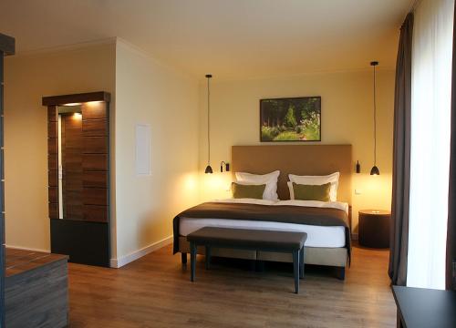 Llit o llits en una habitació de Farmer Hotel Basedow