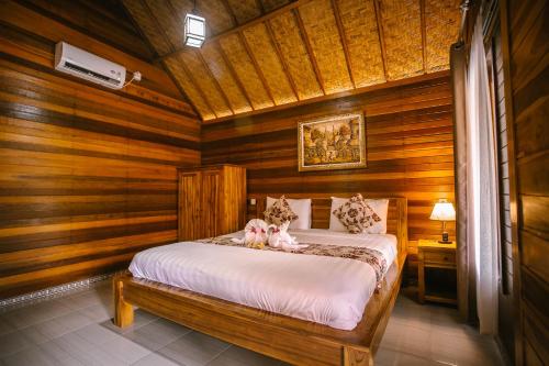 Säng eller sängar i ett rum på The Lanjang valley Bungalow
