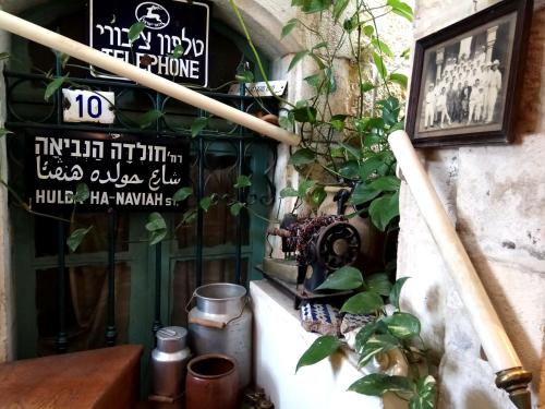 a restaurant with signs on the side of a building at Diana's B&B in Jerusalem