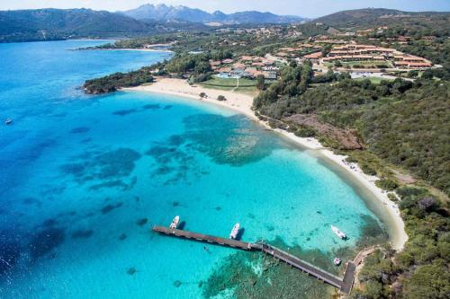 an aerial view of a beach with a pier at Villa Capodorso, Palau Porto Pollo in Palau