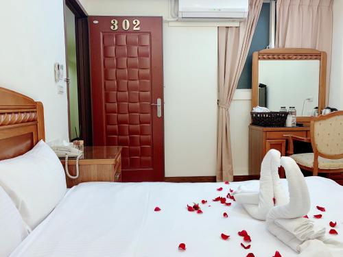 Postel nebo postele na pokoji v ubytování Mucha Boutique Hotel