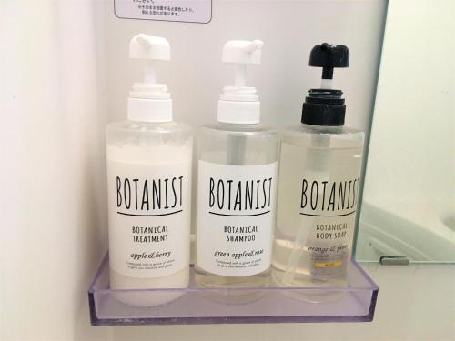 three bottles of bathroom products sitting on a shelf at 002.Standard Number in Kumamoto
