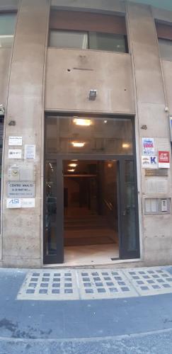 an entrance to a building with a large glass door at BRAKKO 45 in Naples