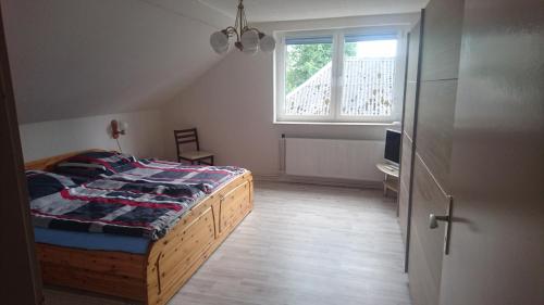 Postel nebo postele na pokoji v ubytování Kummerower See