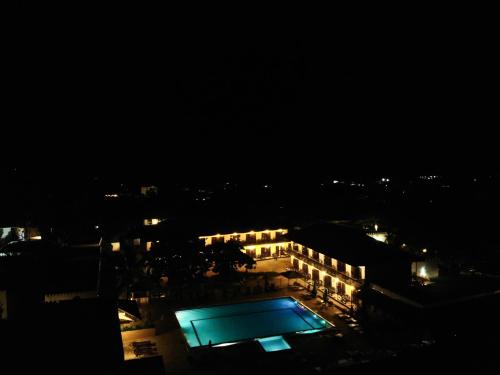an overhead view of a pool at night at Amaan Beach Bungalows in Nungwi