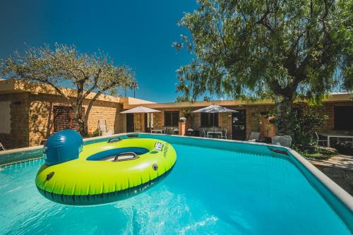 a yellow inflatable raft in a swimming pool at Residence Cala Grande in Cefalù