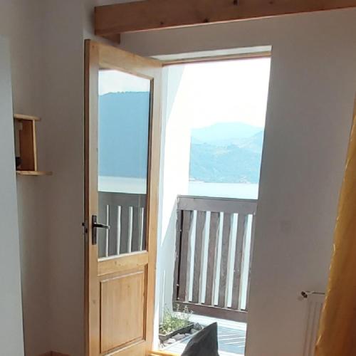 a door leading to a balcony with a view at CONACUL SARBESC in Sviniţa