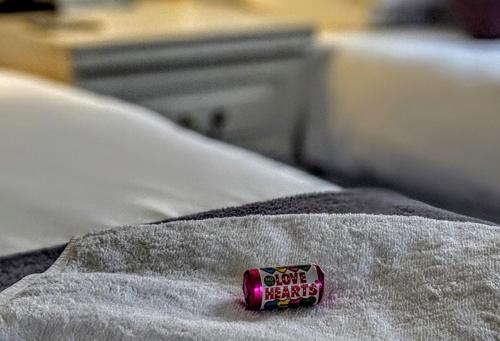 a small toy car sitting on top of a bed at Alexander Lodge in Bournemouth