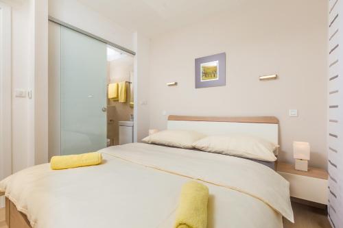 Villa Antonela tesisinde bir odada yatak veya yataklar