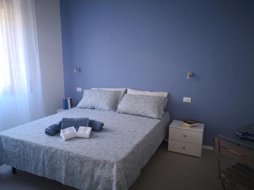 Ένα ή περισσότερα κρεβάτια σε δωμάτιο στο Il Giardino di Anna - Charming rooms in Cagliari