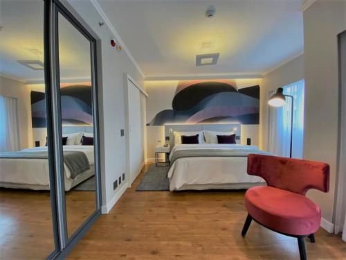 Ein Bett oder Betten in einem Zimmer der Unterkunft Clarion Faria Lima
