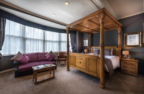 A bed or beds in a room at The Swan Hotel, Stafford, Staffordshire