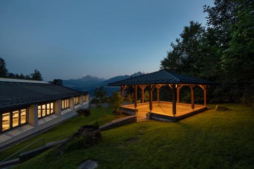 a house with a gazebo in a yard at Seehof Innsbruck in Innsbruck