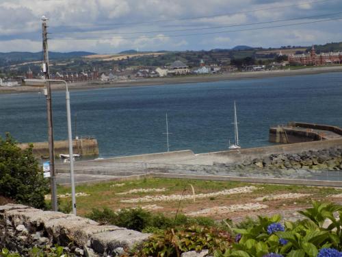 a view of a body of water with a street light at Widows Row Cottage in Newcastle