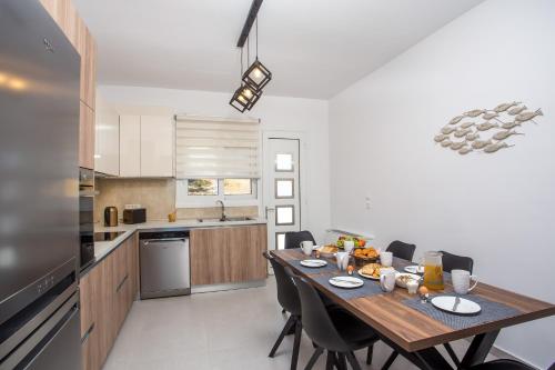 Kuchyň nebo kuchyňský kout v ubytování Kalathos Sea View House