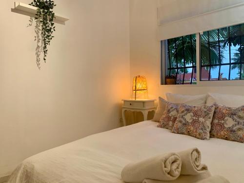 En eller flere senge i et værelse på Villa Ana María