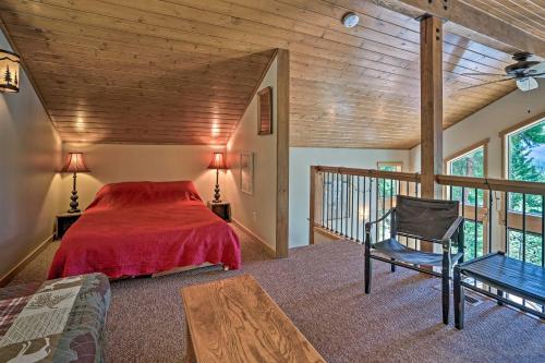 a bedroom with a bed and a chair in a room at Private Leavenworth Cabin with Mtn Views and Fire Pit in Leavenworth