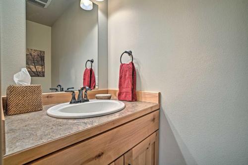 a bathroom with a sink and a mirror at Private Leavenworth Cabin with Mtn Views and Fire Pit in Leavenworth