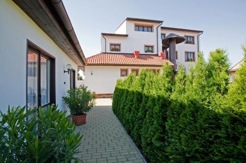 a view of a house from the garden at Pension Minor in České Budějovice