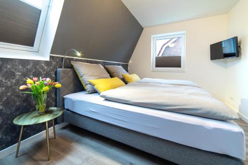 Giường trong phòng chung tại Ferienhaus Muschelpadd 3d