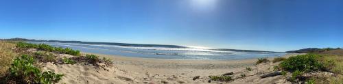 a sandy beach with the ocean in the background at Villas Kalei in Playa Grande