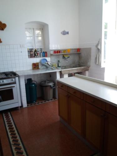 a kitchen with a stove and a counter top at Trekking in paradise B&B in Santa Margherita Ligure