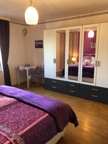a bedroom with a bed and a dresser at Haus Zissi in Burg-Reuland