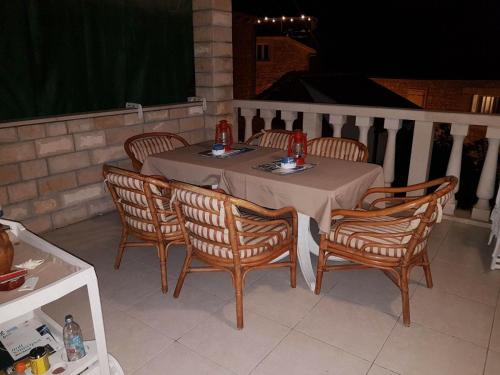 a table and four chairs sitting on a patio at Vila Dora Supetar in Supetar