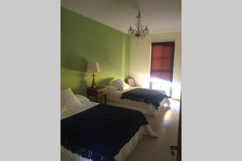 A bed or beds in a room at Appartment in San Miguel de Allende (Zirandaro)