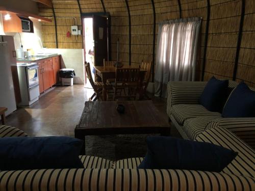 a living room with two couches and a table at Jock of the Bushveld in Barberton