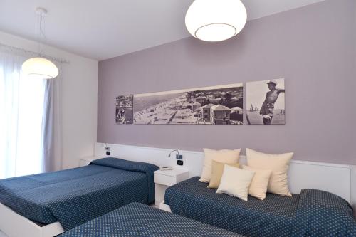 Cama o camas de una habitación en Hotel & Residence Progresso