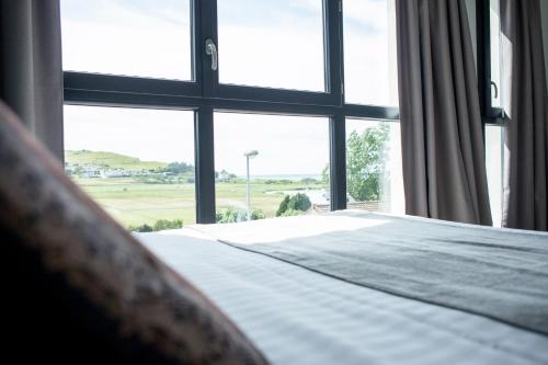 Postel nebo postele na pokoji v ubytování Hotel Les Galets