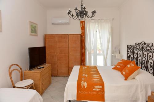 Cama o camas de una habitación en Piccolo Hotel Luisa