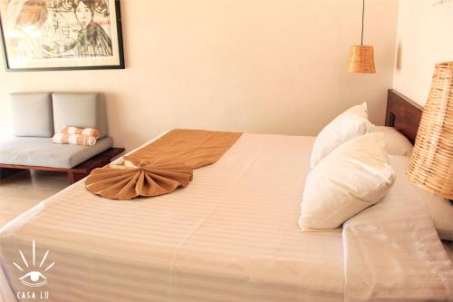 a hotel room with a bed and a desk at Casa Lu Hotel Boutique in Mazunte