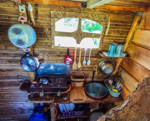 a kitchen in a tiny house with a sewing machine at Gea tree house in Preveza