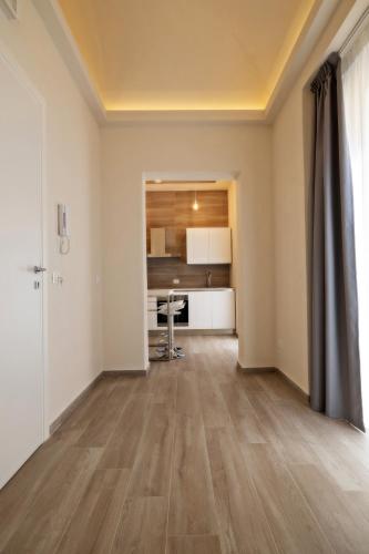 an empty living room with a table in a room at Aria di Mare Apartments in Trapani